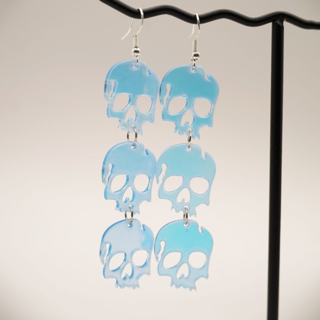 triple holo skull earrings