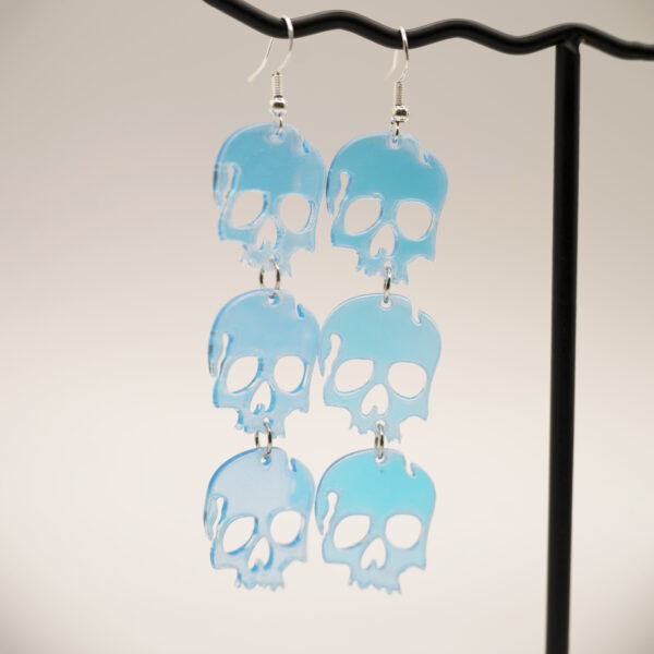 triple holo skull earrings